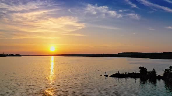 Beautiful sunset on the river. Aerial view of rural river sunset landscape