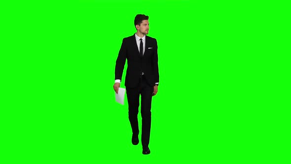 Manager Goes To Meetings and Holds the Documentation. Green Screen