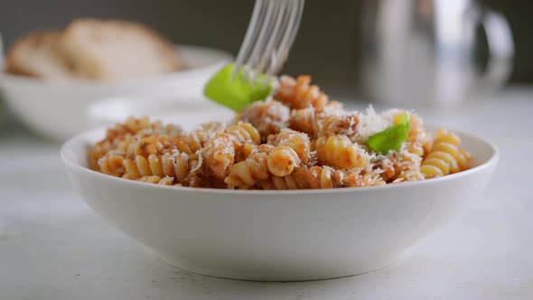 Someone Eat Fusilli Pasta with Tomato Sauce Roasted Eggplant and Parmesan Cheese