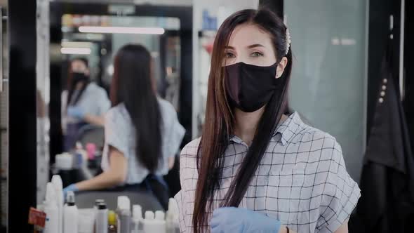 Portrait in a Protective Mask of a Woman Hairdresser or Stylist