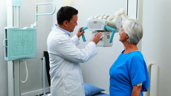 Doctor interacting with senior woman during medical check-up