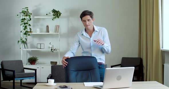 Funny Young Office Leader Boss Manager Dancing in Office, Moving Joyfully with Victory, Twirling