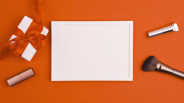 Stop motion animation of mockup white frame white gift present with bow, make up brushes and lipstic alt