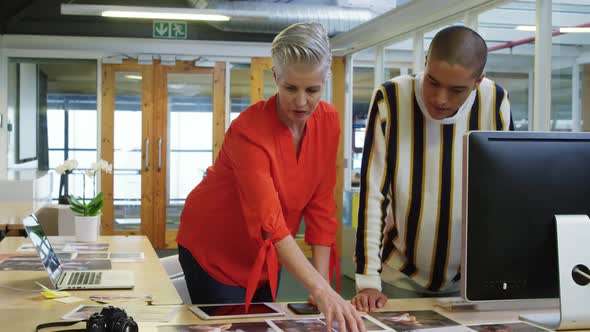 Woman and man working in a creative office