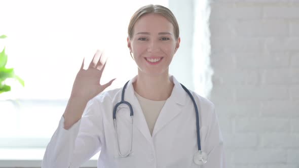 Lady Doctor Waving Hand to Say Hello