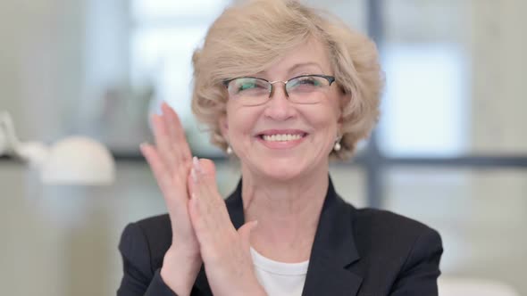 Portrait of Old Businesswoman Clapping Applauding