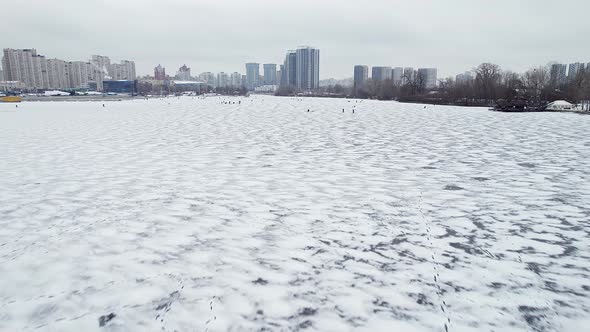 Fishermen Engaged in Ice Fishing in Winter