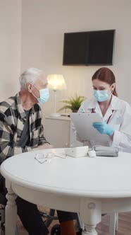 An Elderly Man in a Wheelchair Talks About His Health Problems