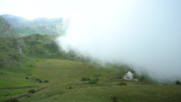 Thick White Fog Covers Mountains and Buildings in Northern Montenegro