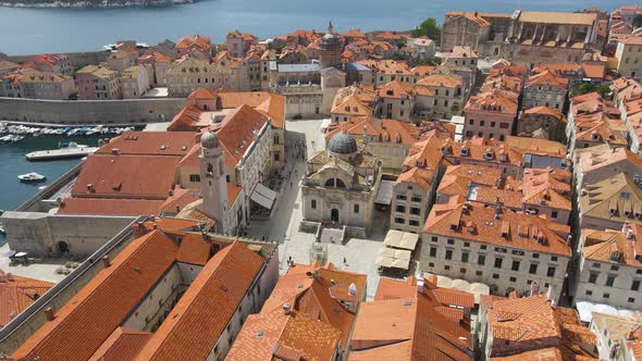 Aerial tilt down shot of the old town of Dubrovnik,Croatia with the view of a cathedral in front of