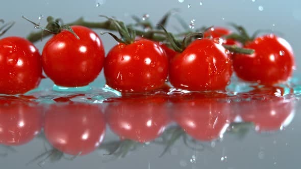 Tomatoes Falling to Water in Super Slow Motion Shot with High Speed Cinema Camera in   1000Fps