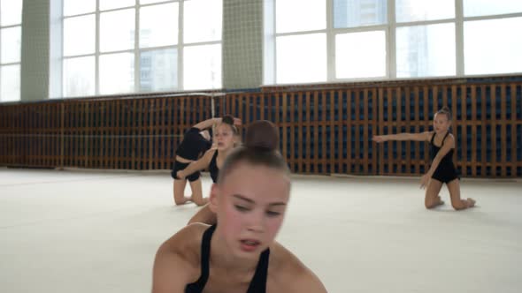 Teenage Girl Practicing Rhythmic Gymnastics