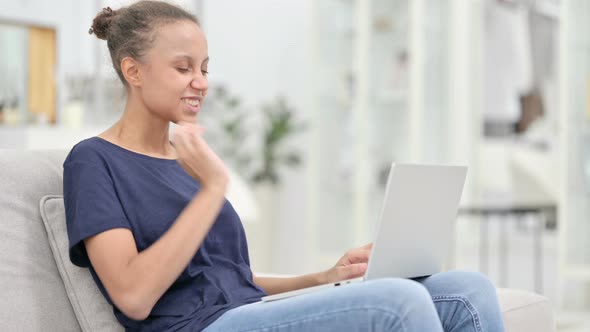 Tired African Woman with Laptop Having Neck Pain at Home 