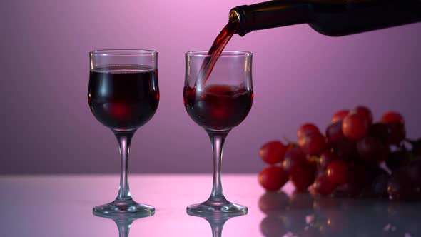 Pouring Red Wine Into the Glass
