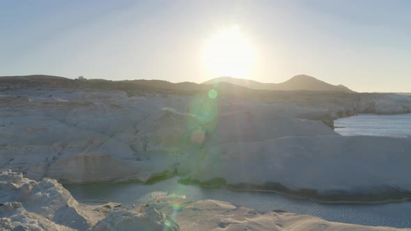 Sun Shining Over White Cliffs in Sarakinko Beach on the Aegean Sea in  Milos