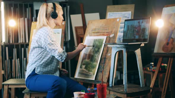 Blond Woman is Having an Online Painting Lesson