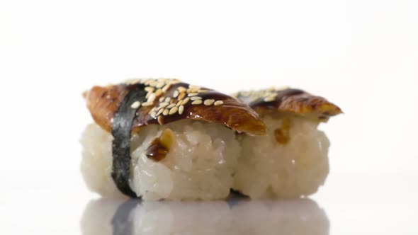 Two Spinning Eel Sushi on the White Background