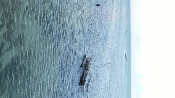 Vertical Video Boats in the Ocean Near the Coast of Zanzibar Tanzania Aerial View