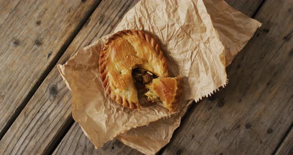 Video of pie seen from above on wooden background