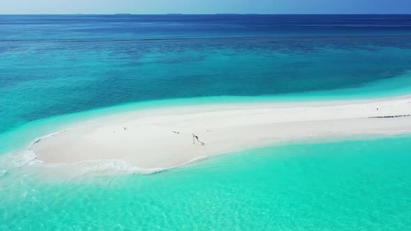 Tropical drone island view of a white paradise beach and aqua blue ocean background 