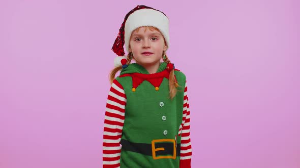 Displeased Child Girl Christmas Elf Gesturing Hands with Displeasure Blaming Scolding for Failure