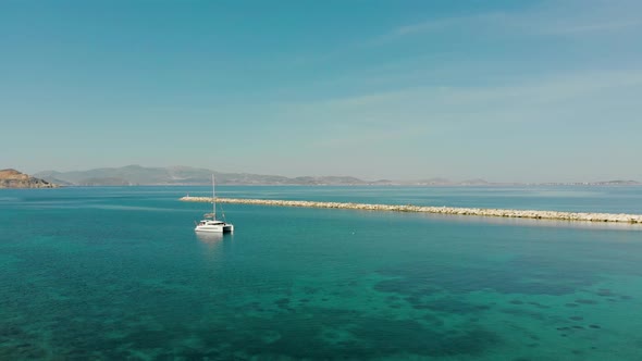 Catamaran Anchoring on the Calm Water