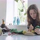 Woman Making Wool Art Doll Toy at Table. Female Sitting and Creating Ooak Doll at Home. Needle - VideoHive Item for Sale