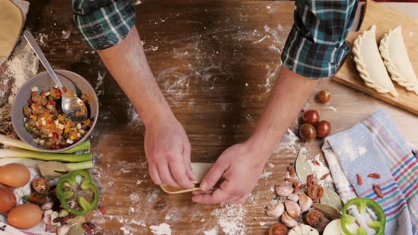 Man Cooking Empanadas Argetinian Pie Traditional Bakery From Argentina Chef Filling Dough in Home