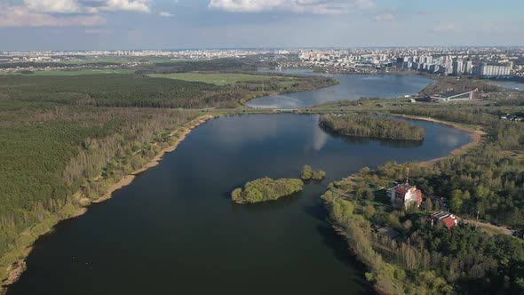 Flying Over a River and Forest Near the City of Minsk