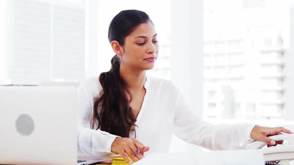 Woman in office making call