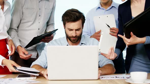 Executive getting frustrated while working at his desk