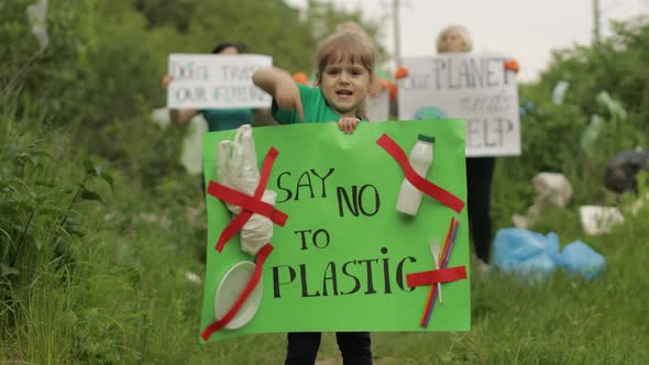 Girl Volunteer Holds Protesting Poster Say No To Plastic. Ecology Trash Nature Pollution. Recycle