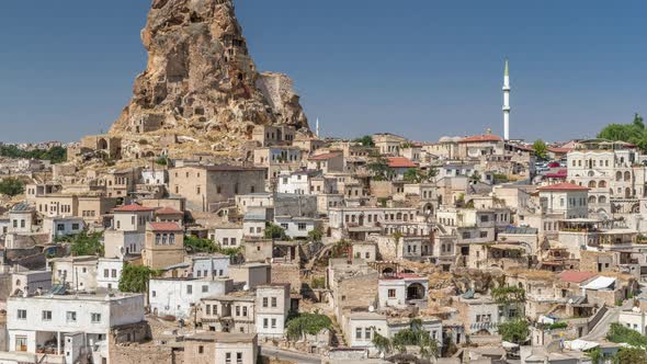 View of Ortahisar Town Old Houses in Rock Formations From Ortahisar Castle Aerial Timelapse.