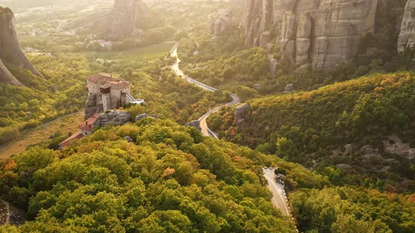 Aerial drone view of the Meteora in Greece at sunset. Rock formations with Orthodox monasteries
