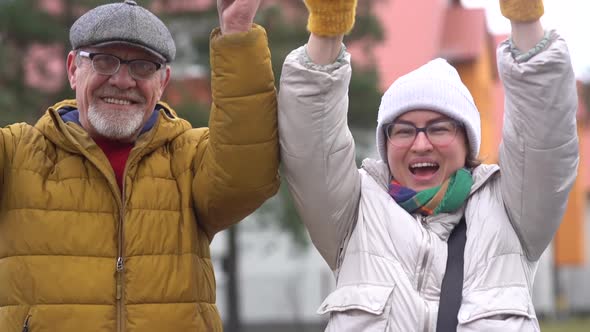 Outdoor Portrait of Smiling People with Inscriptions in Support of the Antivaccination Movement in