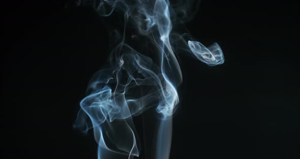 Smoke of Cigarette rising against Black Background, Slow Motion 4K