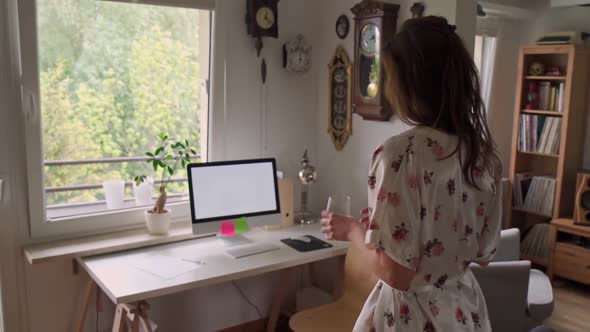 Woman in Pajamas Working Remotely at Home During a Pandemic in Slow Motion