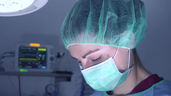 Woman Performing Surgery In Hospital