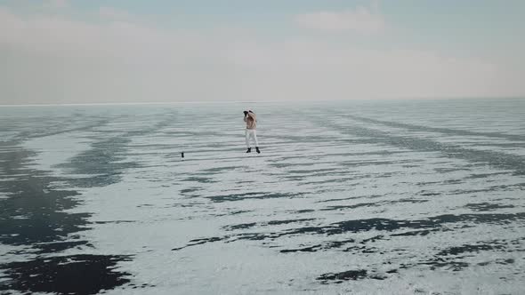 Stylish Young Woman Professional Dancer Dancing Energetic Jazz Funk or Hip Hop on Arctic Frozen Lake