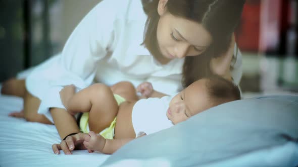 Young MotHer Kissed a Little Baby Gently With Love