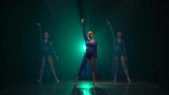 Three Gorgeous Professional Ballerinas Are Dancing Elements of Modern Ballet.