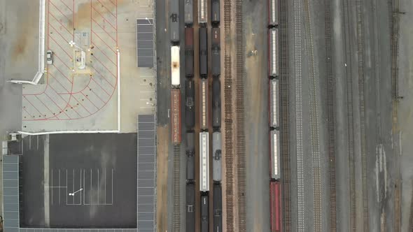 Top Down Aerial of Train Cars Parked in Railway Station