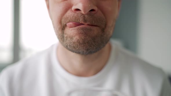 Man Drinking Cocoa with Marshmallows