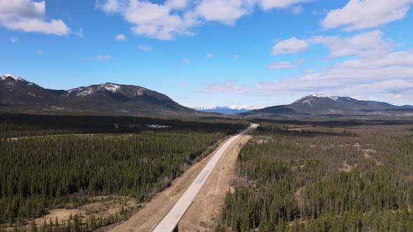 Aerial View Of Highway and Snow Top Mountains Near Nordegg Alberta Cananda