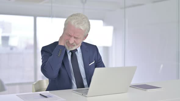 Old Businessman Having Neck Pain at Work