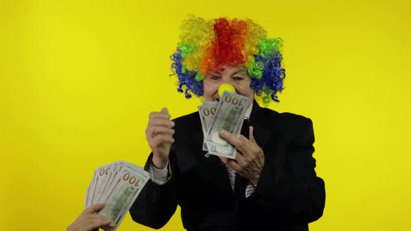 Clown Businesswoman Freelancer Receives Money Income While Using Smartphone