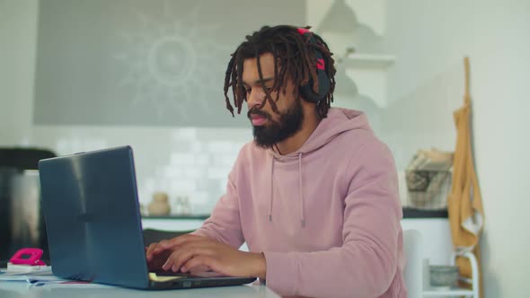 African American Student E-learning with Laptop