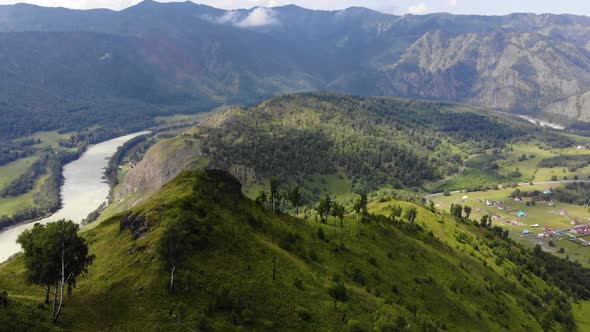 Aerial Point of View. Altai Mountain. Low Altitude Flight Over Mountain. Panorama of the Valley with