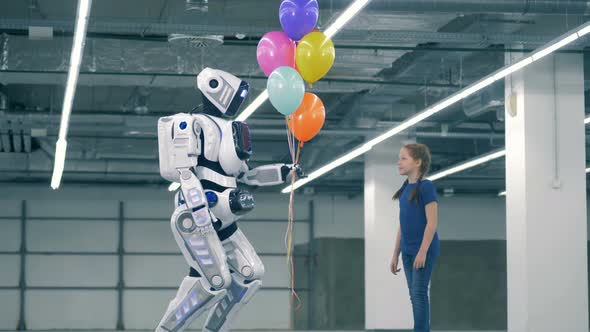 White Android Gives Colorful Balloons To a Girl
