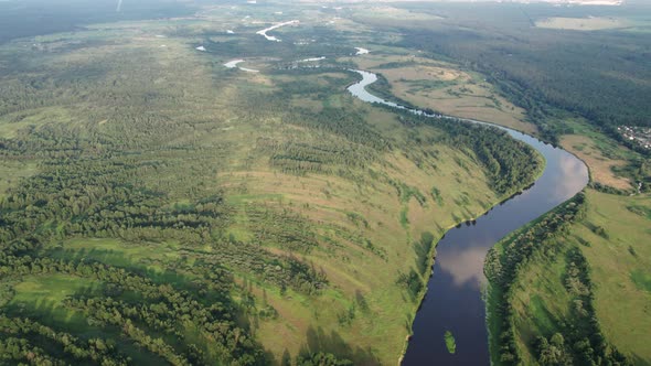 Meandering River Flowing Through a Wooded Rural Area